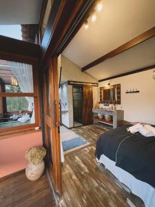 Cama ou camas em um quarto em I'Lumiar Loft