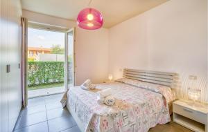 A bed or beds in a room at Nice Apartment In Puegnago Sul Garda
