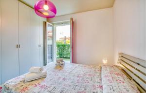 A bed or beds in a room at Nice Apartment In Puegnago Sul Garda