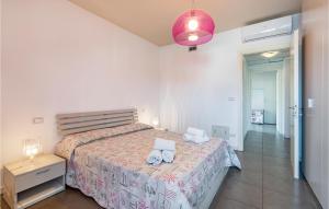 A bed or beds in a room at Nice Apartment In Puegnago Sul Garda