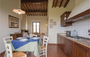 a kitchen with a table with a blue table cloth at Gardenia in Cerreto Guidi
