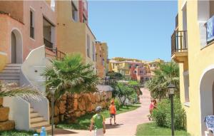 a group of people walking down a street with buildings at Trilo 6 in Cuile Pazzoni