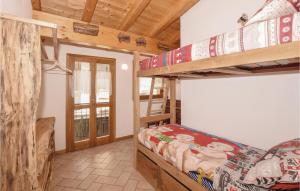 a bedroom with two bunk beds in a cabin at Ca De Gasper in Ballabio