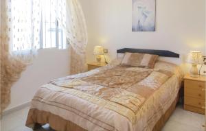 A bed or beds in a room at Beautiful Apartment In Torrevieja