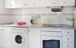 A kitchen or kitchenette at Beautiful Apartment In Torrevieja