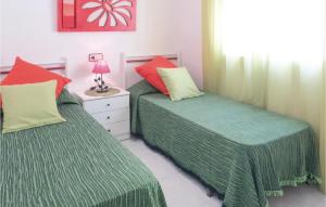 A bed or beds in a room at Beautiful Apartment In Torrevieja