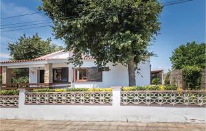 a white house with a fence at 3 Bedroom Nice Home In Vidreres in Vidreres
