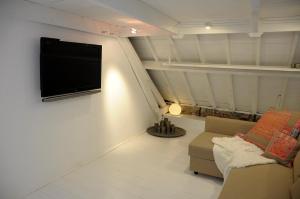 A television and/or entertainment centre at Attic Room Judy's