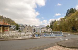 a street in a town with buildings and a road at Nice Apartment In La Bourboule With 1 Bedrooms in Le Mont-Dore