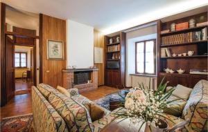 a living room with a couch and a fireplace at Casa Martina in San Gimignano