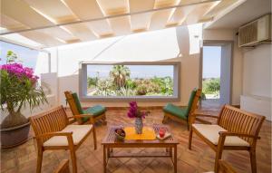 a living room with chairs and a table at Casa Solare in Marsala