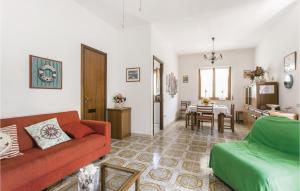 a living room with a couch and a table at Villa Silvana in Porto Clementino