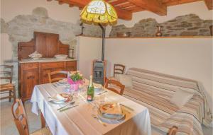 a dining room with a table and a bed at Agriturismo La Ginestra in Lama