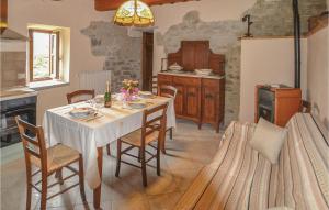 a kitchen with a table and chairs in a room at Agriturismo La Ginestra in Lama