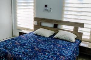 Letto o letti in una camera di 24-7 Electricity Agore Hotels and Suites Ltd