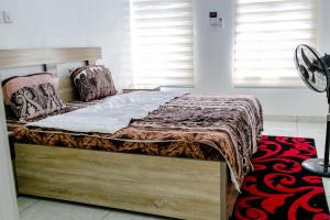Letto o letti in una camera di 24-7 Electricity Agore Hotels and Suites Ltd