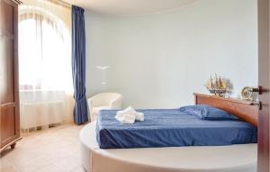 A bed or beds in a room at Villa Aquaro