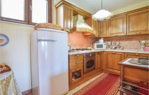 A kitchen or kitchenette at Villa Aquaro