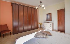 A bed or beds in a room at Villa Aquaro