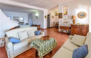 a living room with a couch and a table at Villa Antica in Stalettì