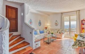 a living room with a couch and a table at Villa Antica in Stalettì