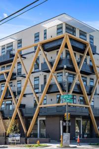 a tall building with wooden beams on the side of it at Colorful Western Vibe - Pet-Friendly - Zuni Lofts in Denver