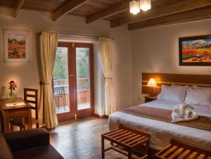 Voodi või voodid majutusasutuse Sol Ollantay Boutique Hotel toas