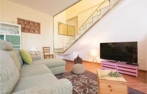 a living room with a couch and a flat screen tv at Casa Livio in Ponte Buggianese