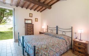 a bedroom with a bed and a large window at L'ortale in Pitigliano