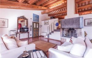 a living room with white furniture and a fireplace at Ca Dotta in Thiene