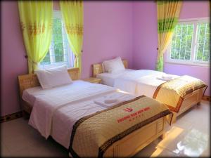 Ένα ή περισσότερα κρεβάτια σε δωμάτιο στο Phuong Nam Hotel
