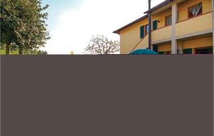 a view of a building from behind a fence at Casale Del Borgo 6 in Querce +16 photos