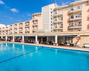 a swimming pool in front of a hotel at Globales Playa Santa Ponsa in Santa Ponsa
