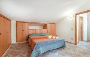 a bedroom with a bed with two pillows on it at Casa Antonio in Mandra Capreria