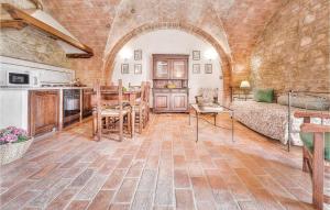 a living room with a couch and a table at Alessandro - Podere Moricci in Montaione +11 photos