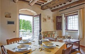 a dining room with a table with plates on it at Sangiovese 1 in San Donato in Poggio