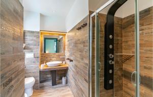 a bathroom with a sink and a shower at 5 Bedroom Amazing Home In Torvaianica in Torvaianica