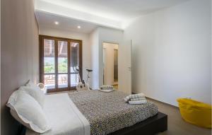 a bedroom with a large bed and a window at Nice Apartment In Comiso in Comiso
