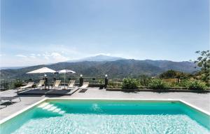 a swimming pool with a view of the mountains at Villa Bellavista in Gaggi