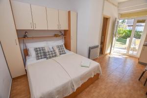Posteľ alebo postele v izbe v ubytovaní Apartments Flora