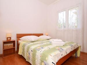 Posteľ alebo postele v izbe v ubytovaní Apartment NADA