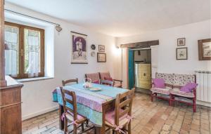 a dining room with a table and chairs at Val Del Lago in Apecchio