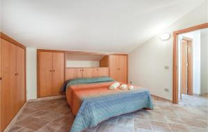 a bedroom with a bed with two pillows on it at Casa Giuseppa in Mandra Capreria