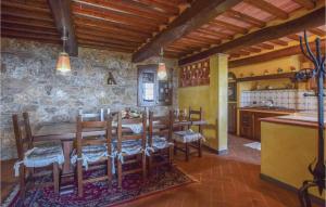 a kitchen and dining room with a wooden table and chairs at Villa Marta Maria in Camaiore