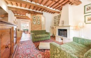 a living room with a couch and a fireplace at Corte Pasquini in San Ginese