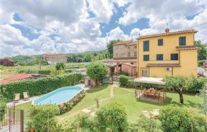 a property with a swimming pool and a building at Corte Pasquini in San Ginese
