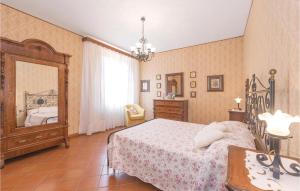 a bedroom with a bed and a large mirror at Villa Il Colle in Molezzano