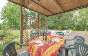 a table with chairs and a table cloth on a patio at Villa Il Colle in Molezzano
