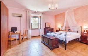 A bed or beds in a room at Tenuta Erbanera