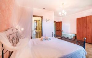 A bed or beds in a room at Tenuta Erbanera